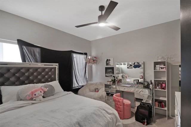 bedroom featuring ceiling fan and light colored carpet