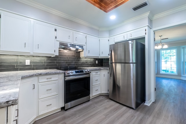 kitchen featuring ornamental molding, appliances with stainless steel finishes, light stone countertops, and white cabinets