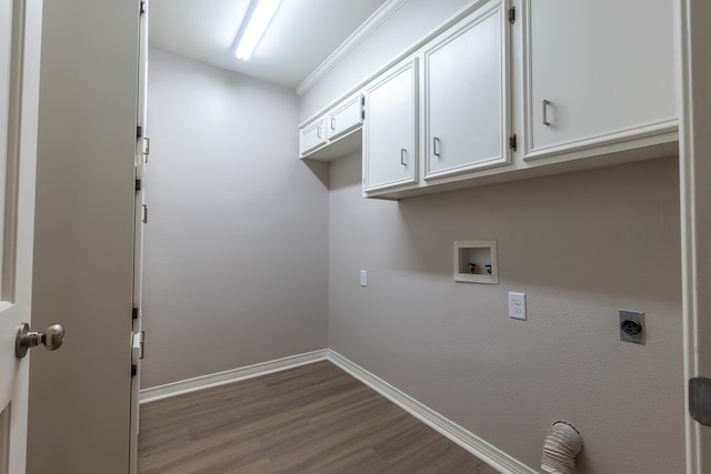 laundry area with cabinets, hardwood / wood-style floors, electric dryer hookup, and washer hookup