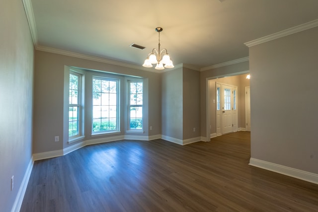 spare room with dark hardwood / wood-style flooring, a notable chandelier, and ornamental molding