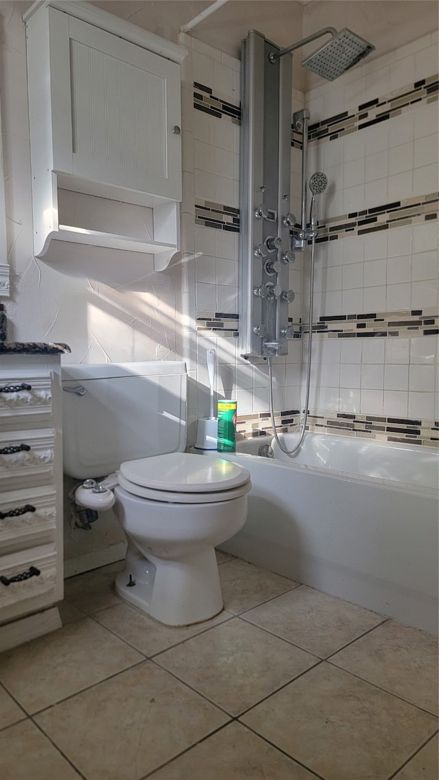 bathroom featuring tiled shower / bath combo, toilet, tasteful backsplash, and tile patterned flooring