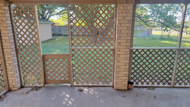 doorway to outside with concrete flooring