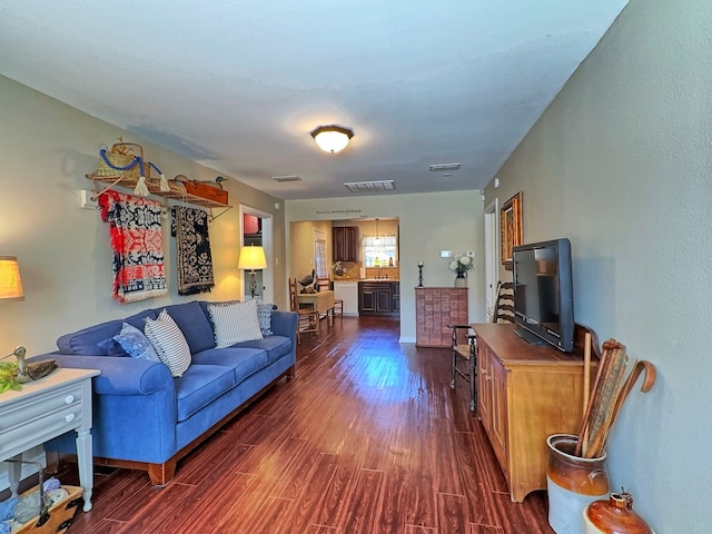 living room with dark wood-type flooring