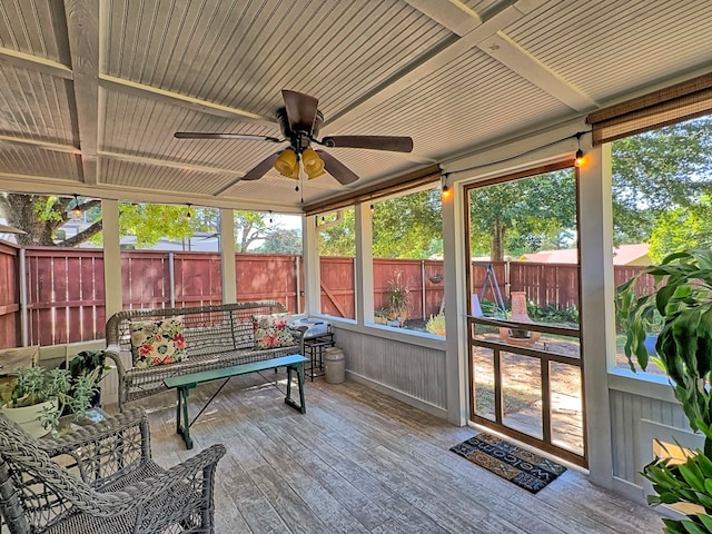 sunroom with ceiling fan