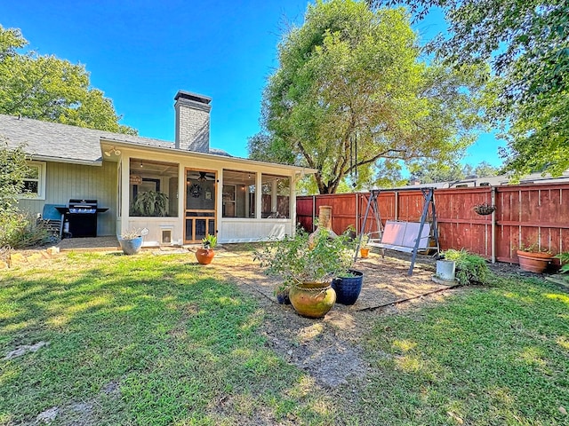 view of yard with a sunroom