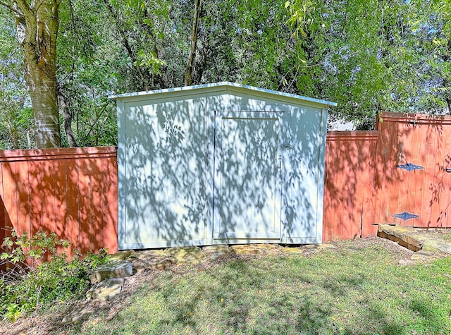 view of outbuilding featuring a yard