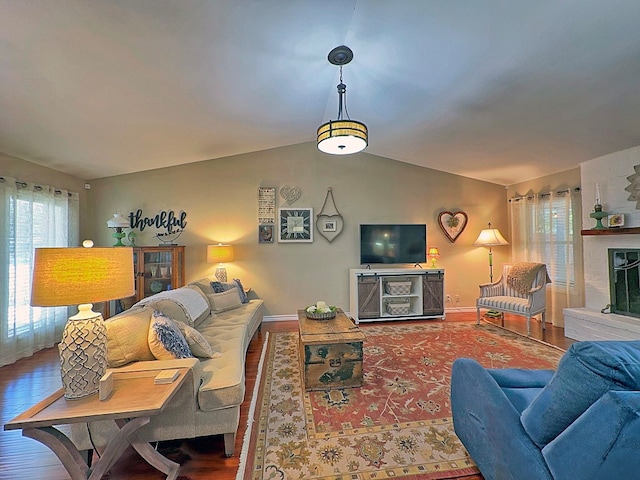 living room with lofted ceiling and hardwood / wood-style floors