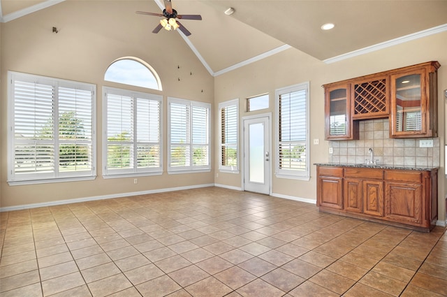 interior space featuring lofted ceiling, sink, and ceiling fan