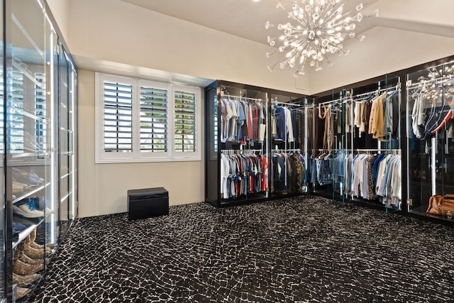 walk in closet featuring carpet flooring and lofted ceiling