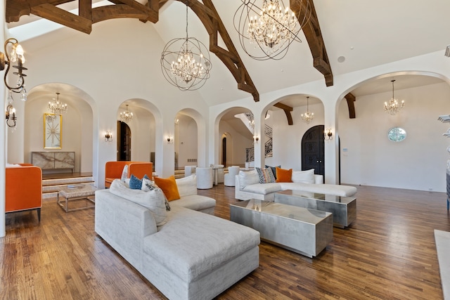 living room with high vaulted ceiling, beamed ceiling, and dark hardwood / wood-style floors