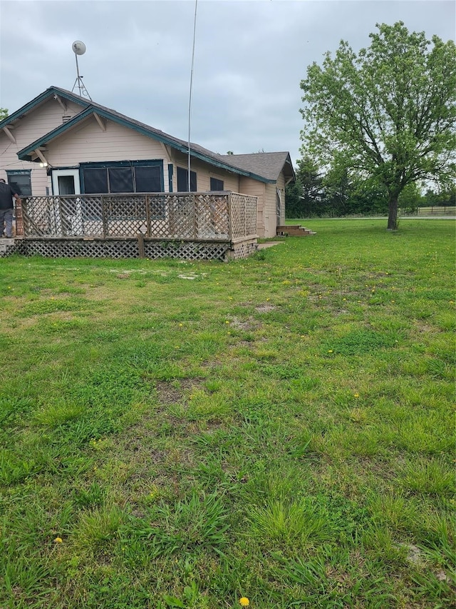 view of yard with a deck