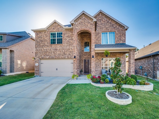 view of front property with a garage and a front lawn