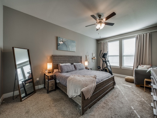 bedroom with ceiling fan and carpet