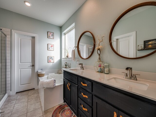 bathroom with vanity, plus walk in shower, and tile patterned flooring