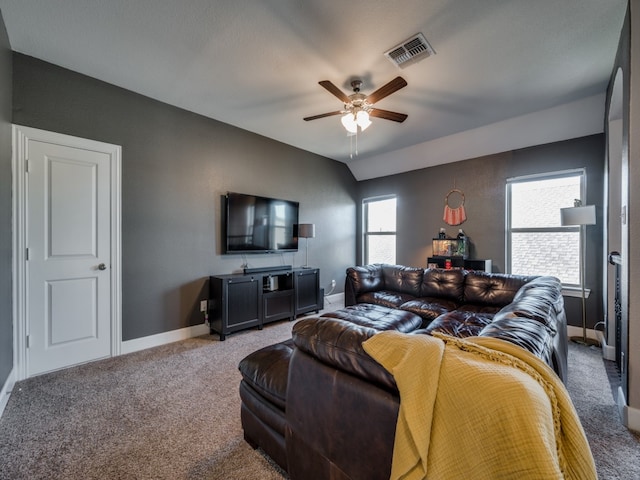 carpeted living room featuring ceiling fan