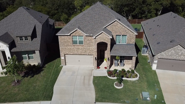 view of front facade featuring a front yard and a garage