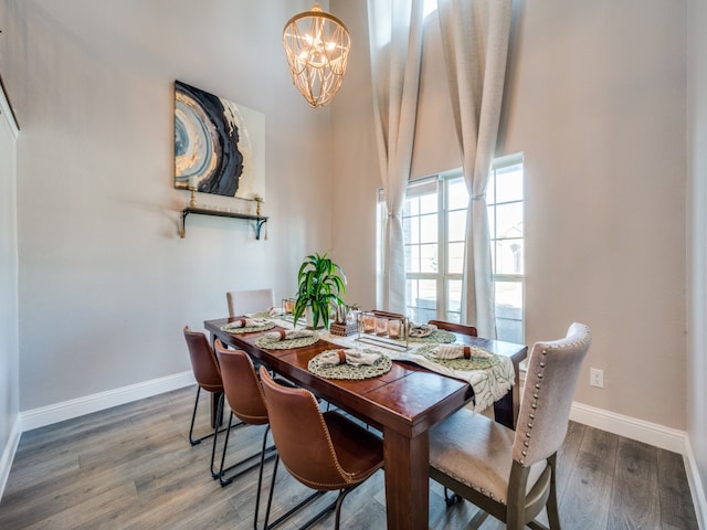 dining room featuring a chandelier and hardwood / wood-style flooring