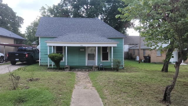 bungalow with a front yard