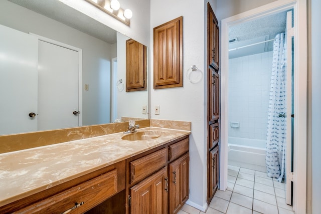 bathroom with vanity, shower / tub combo, a textured ceiling, and tile patterned floors