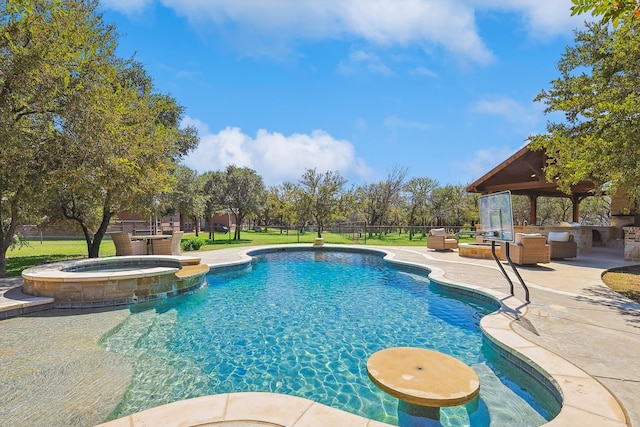 view of swimming pool with a patio and an in ground hot tub