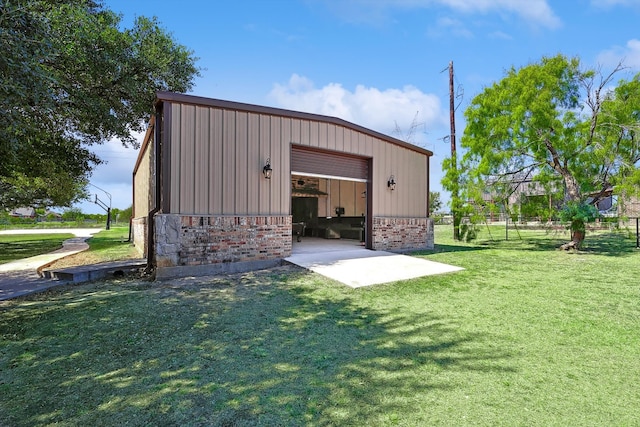 view of outbuilding featuring a yard