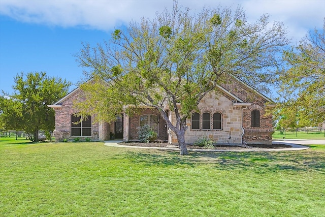 130 Antler Ridge Ct, Azle, TX 76020 - view of front facade with a front yard, brick siding, and stone siding