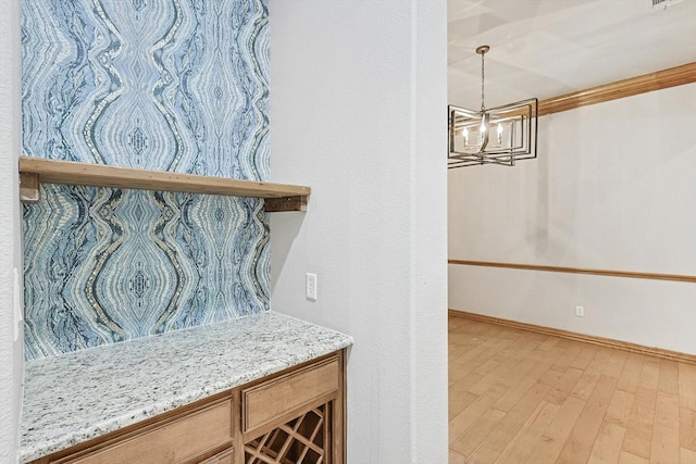 130 Antler Ridge Ct, Azle, TX 76020 - detailed view of a chandelier, wood finished floors, baseboards, and ornamental molding