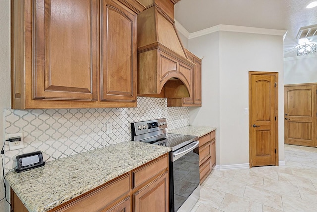130 Antler Ridge Ct, Azle, TX 76020 - kitchen featuring stainless steel electric range, crown molding, decorative backsplash, light stone counters, and baseboards