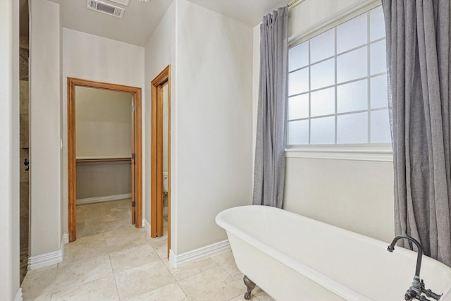 130 Antler Ridge Ct, Azle, TX 76020 - full bath featuring a freestanding tub, baseboards, and a spacious closet