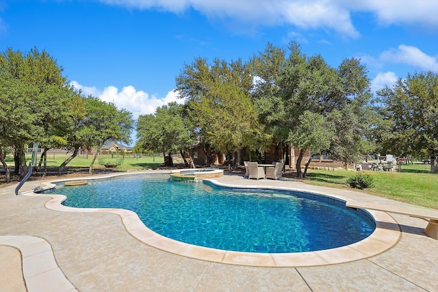 view of swimming pool with a lawn and a patio area