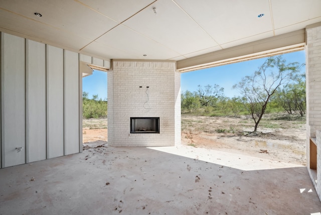 view of patio / terrace with an outdoor brick fireplace