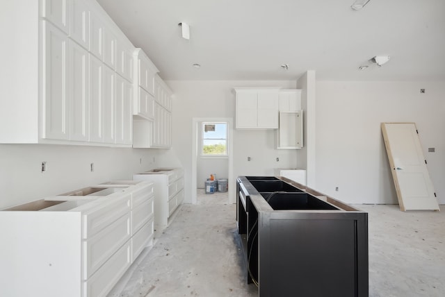 kitchen featuring white cabinetry and a center island