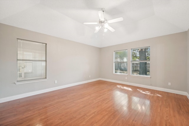 empty room featuring wood-type flooring and ceiling fan