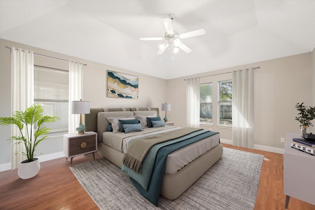 bedroom with ceiling fan and hardwood / wood-style flooring