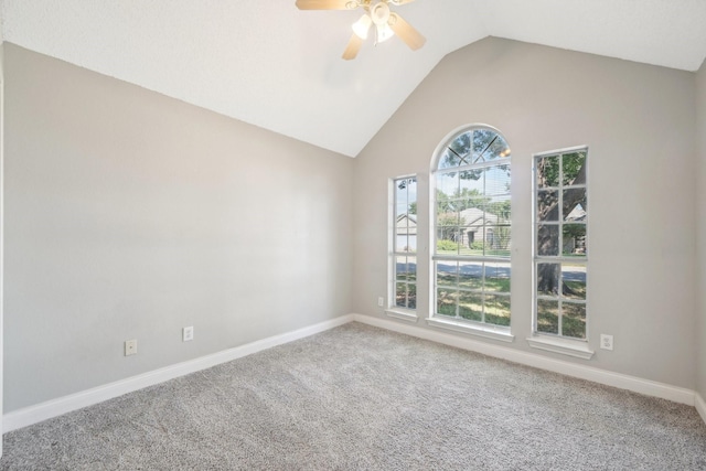 unfurnished room featuring carpet flooring, ceiling fan, and vaulted ceiling