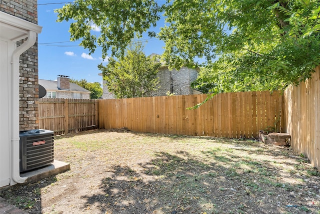 view of yard with central AC unit