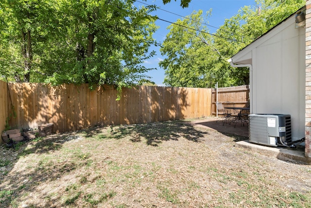 view of yard with central AC unit