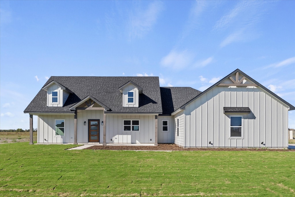 modern farmhouse with a front lawn