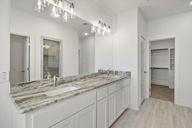 bathroom with vanity and an enclosed shower