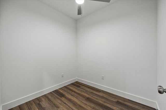 spare room featuring dark hardwood / wood-style floors and ceiling fan