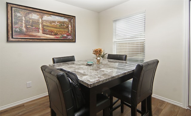 dining area featuring dark hardwood / wood-style floors