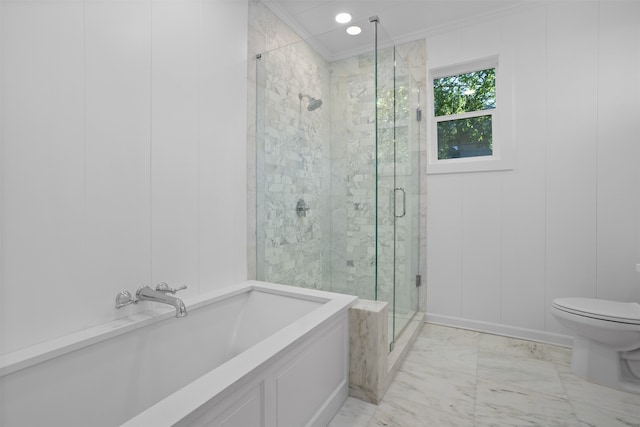 bathroom with crown molding, toilet, and a shower with door