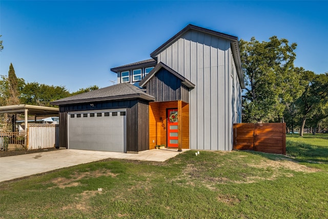 view of front of property with a garage and a front yard