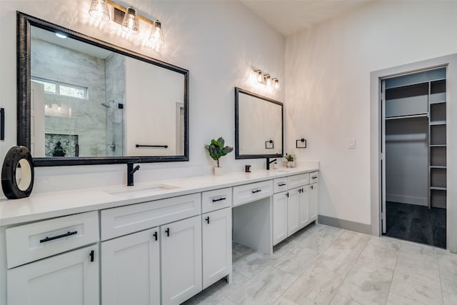 bathroom featuring vanity and a shower with shower door