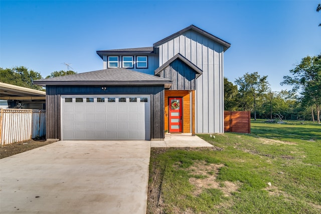 view of front of home with a garage and a front yard