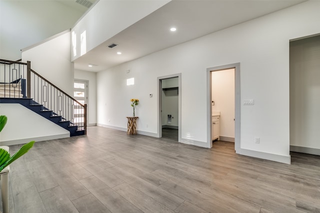 foyer entrance with light hardwood / wood-style floors