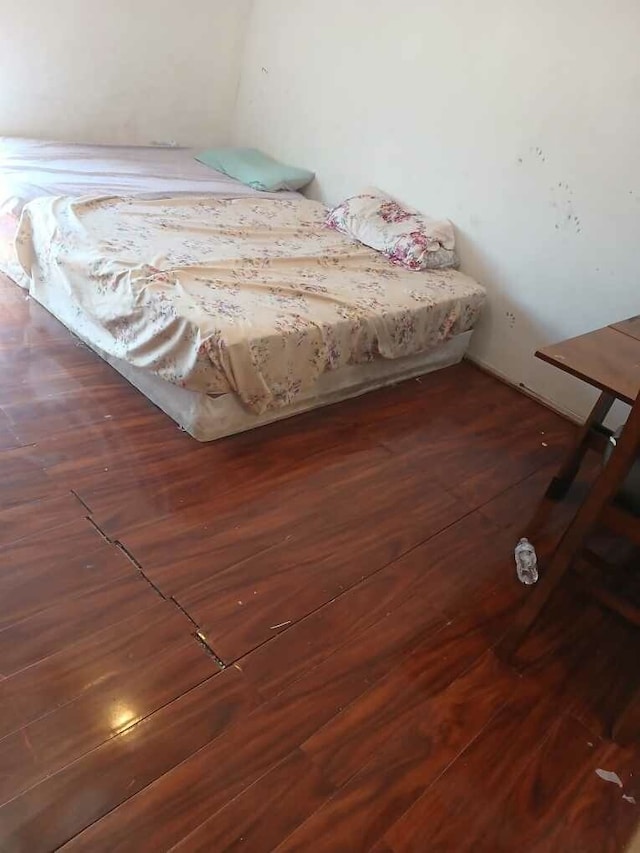 unfurnished bedroom featuring dark wood-type flooring