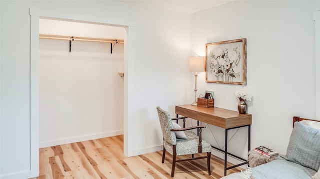 office with light hardwood / wood-style floors