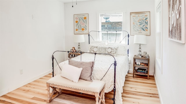 bedroom with hardwood / wood-style floors