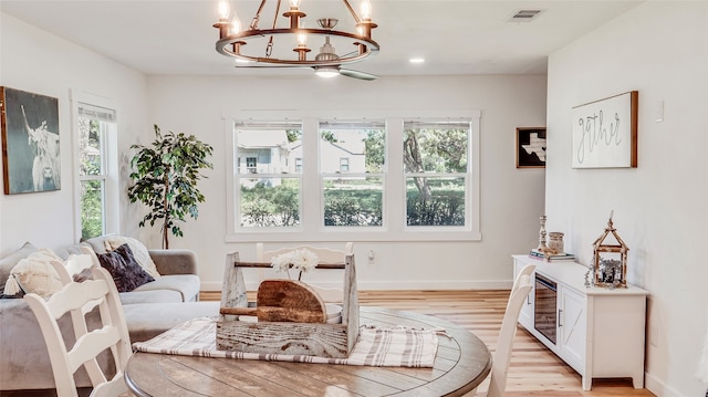 living room featuring light hardwood / wood-style flooring and a chandelier